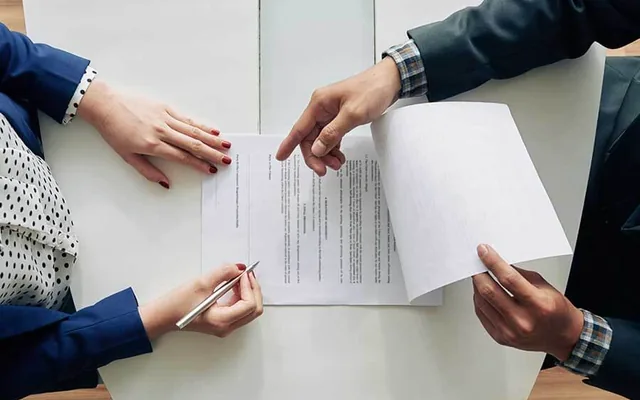 Person reviewing loan-signing documents